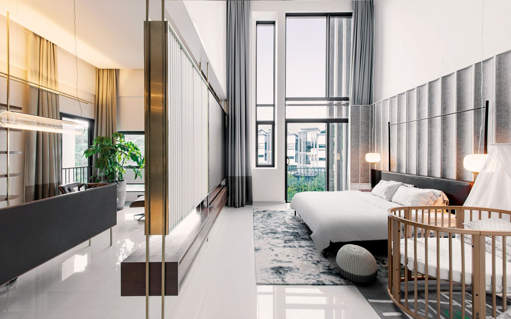 The large expanse of the master bedroom is divided into smaller areas with intricately detailed screens
