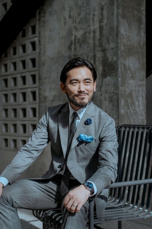 Aaron Chin wearing Omega Constellation Gents 41mm in steel and Sedna gold with sun-brished blue dial