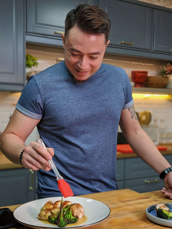 Sherson Lian putting the finishing touches on his Chinese New Year dish