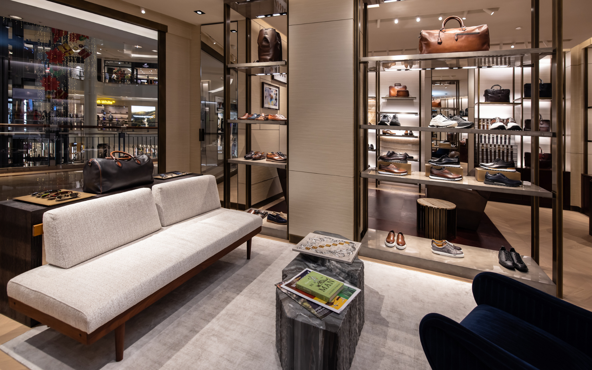 Behind its wide glass façade, which includes a shop window and a light box, the collections of men's shoes, leather goods, ready-to-wear and accessories are displayed to highlight the unique artisanship and bespoke work.