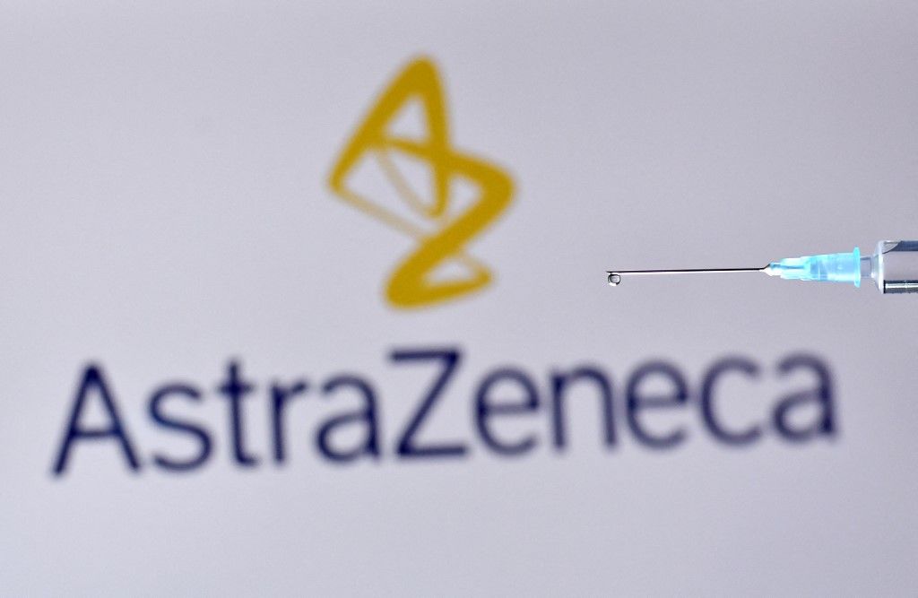 (FILES) In this file photo taken on November 17, 2020 a drop from a syringe with the logo of British pharmaceutical company AstraZeneca. - AstraZeneca, the British maker of a Covid vaccine with Oxford University, said that net profit more than doubled last year to $3.2 billion on strong sales of new cancer drugs on February 11, 2021. (Photo by JUSTIN TALLIS / AFP)
