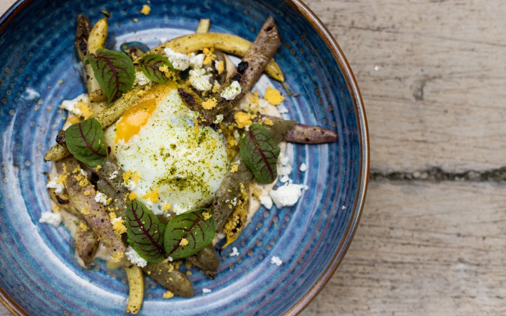 Charred fresh and marinated heirloom beans with crumbled feta & a free-range egg