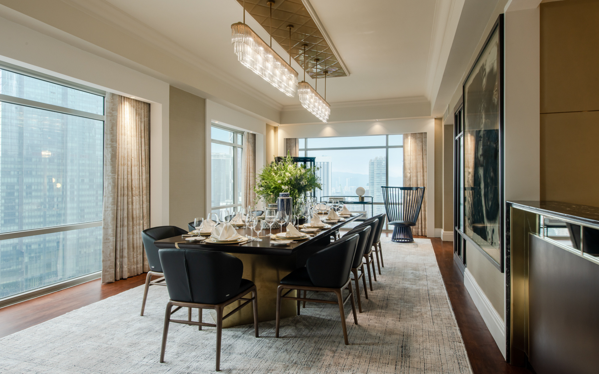 The spacious 10 seater dining table is set for a dinner party with fine Noritake China (Photo: David Yeow Photography)