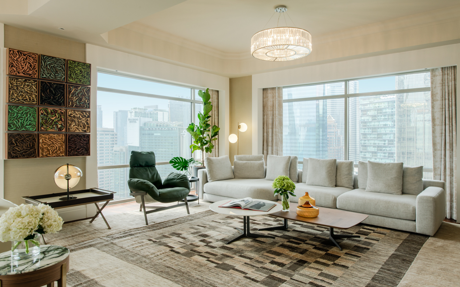 The sleek lines of furniture by Arketipo and Olta from Tekni contrast pleasingly against artwork by Mohd Fairuz Paisan of discarded wood (Photo: David Yeow Photography)