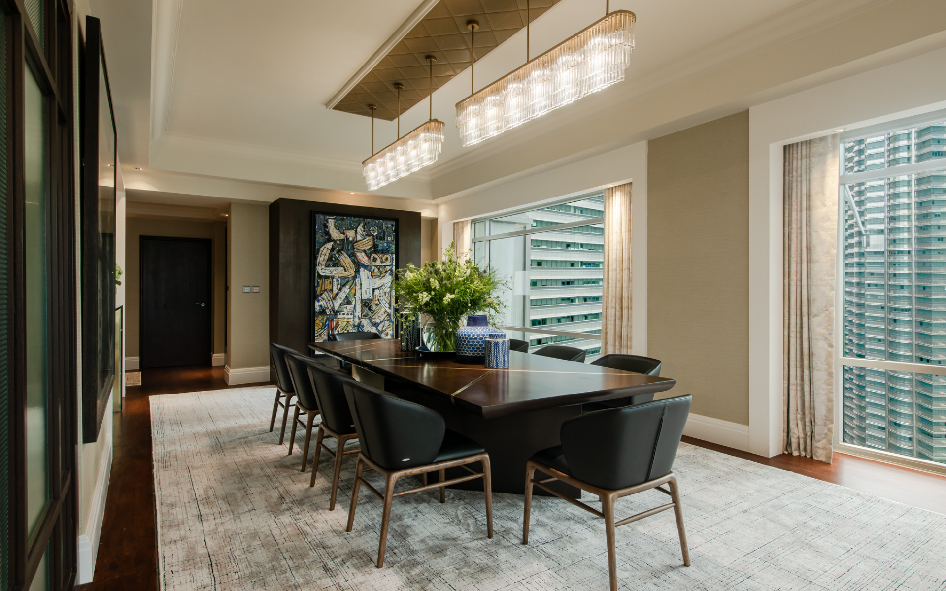 The dining room features the interactive work of Nor Tijan Firdaus and the Petronas Twin Towers just beyond its windows