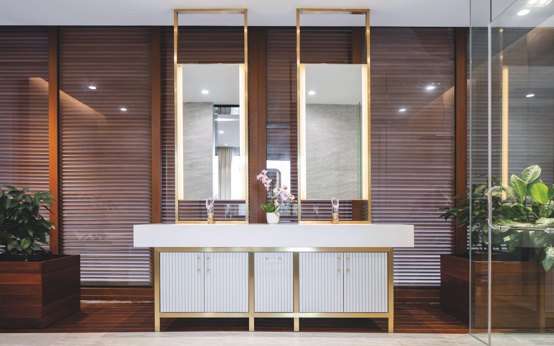 Timbre louvers add warmth yet create privacy in the master bathroom
