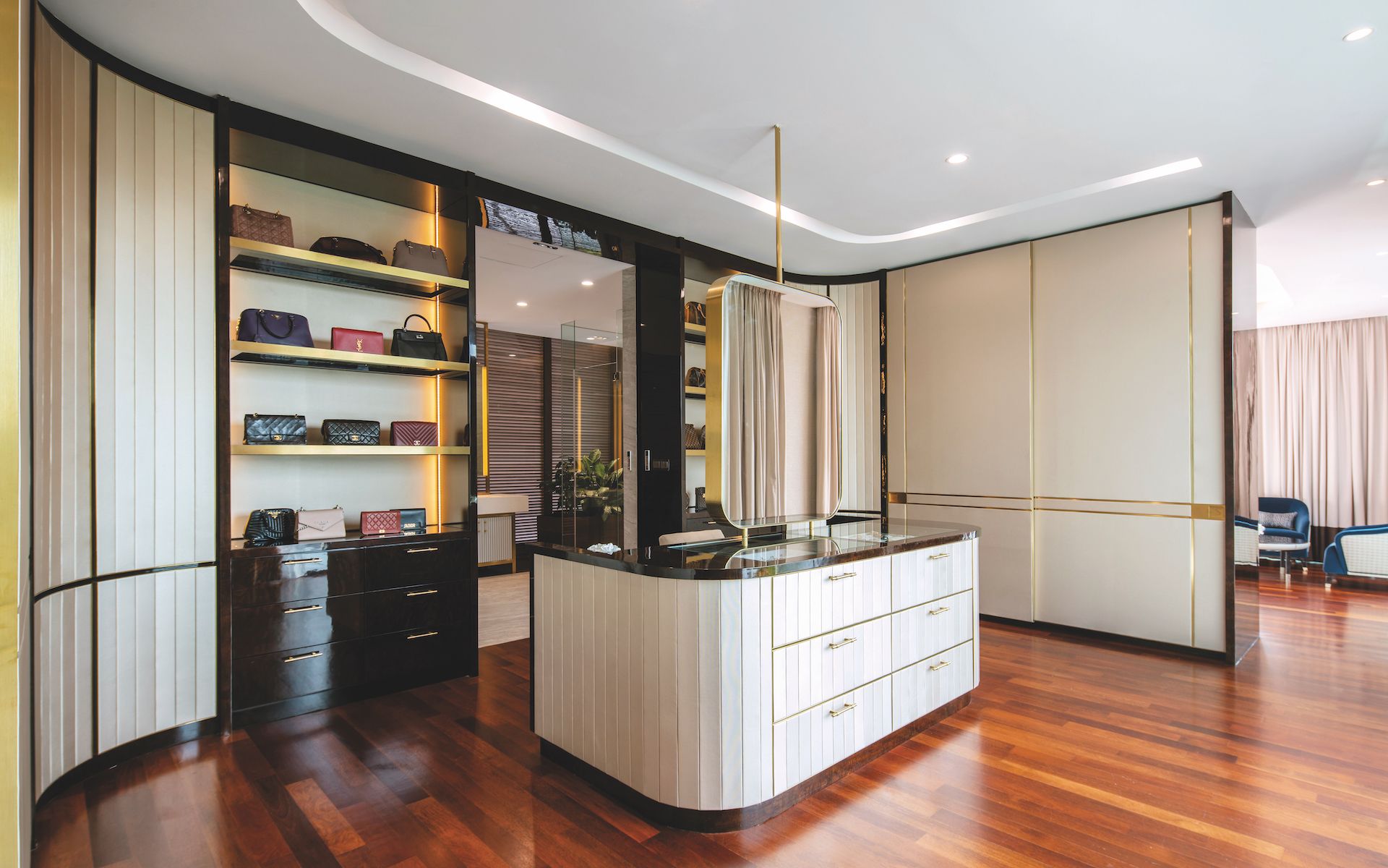 The walk-in wardrobe in the master bedroom has plenty of handsomely realised display and storage space