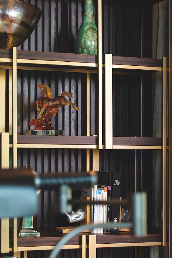 Personal items are neatly arranged on the shelves for a Zoom-worthy backdrop