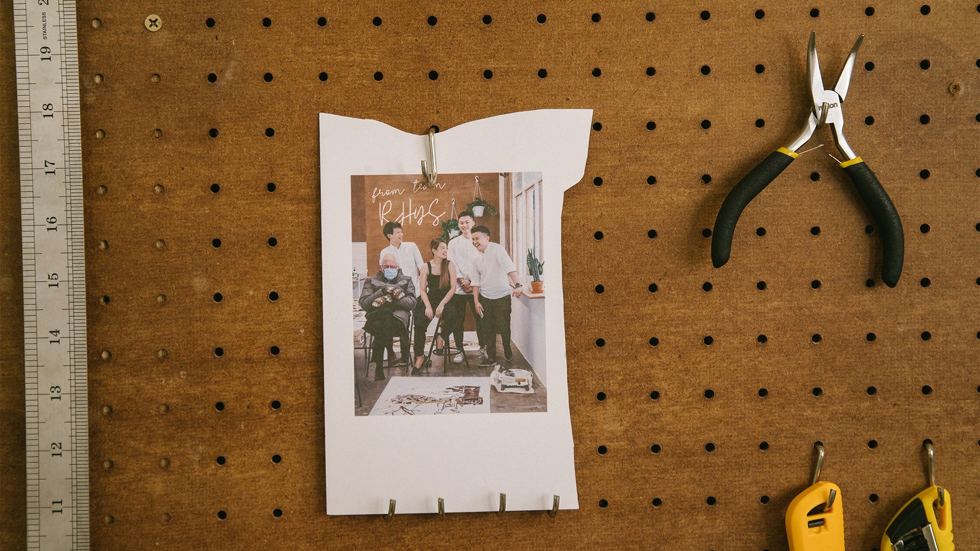 A polaroid of Red Hongyi and her team stands out at the back of the studio