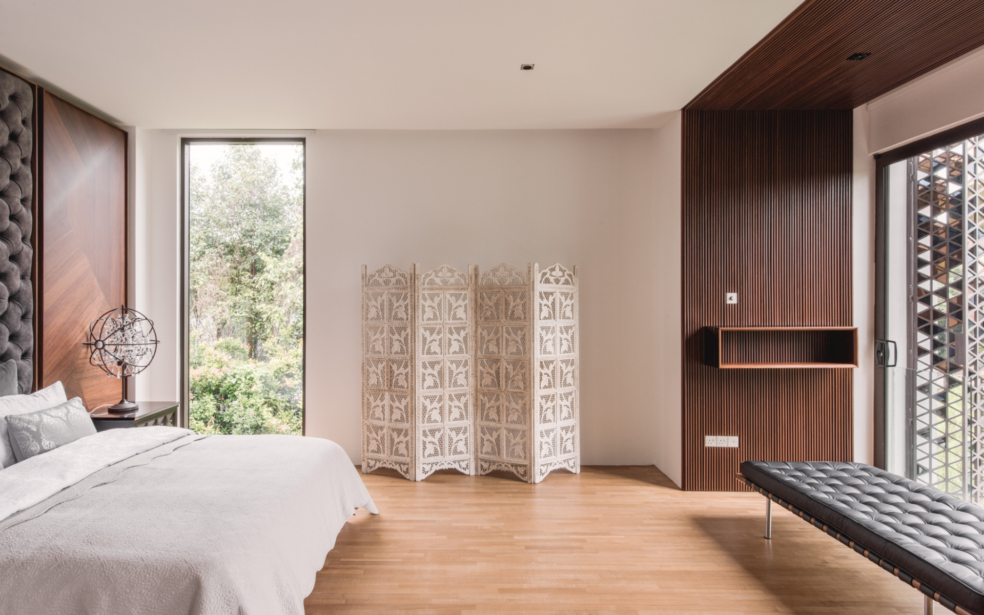 Minimally furnished, the master bedroom is a tranquil oasis