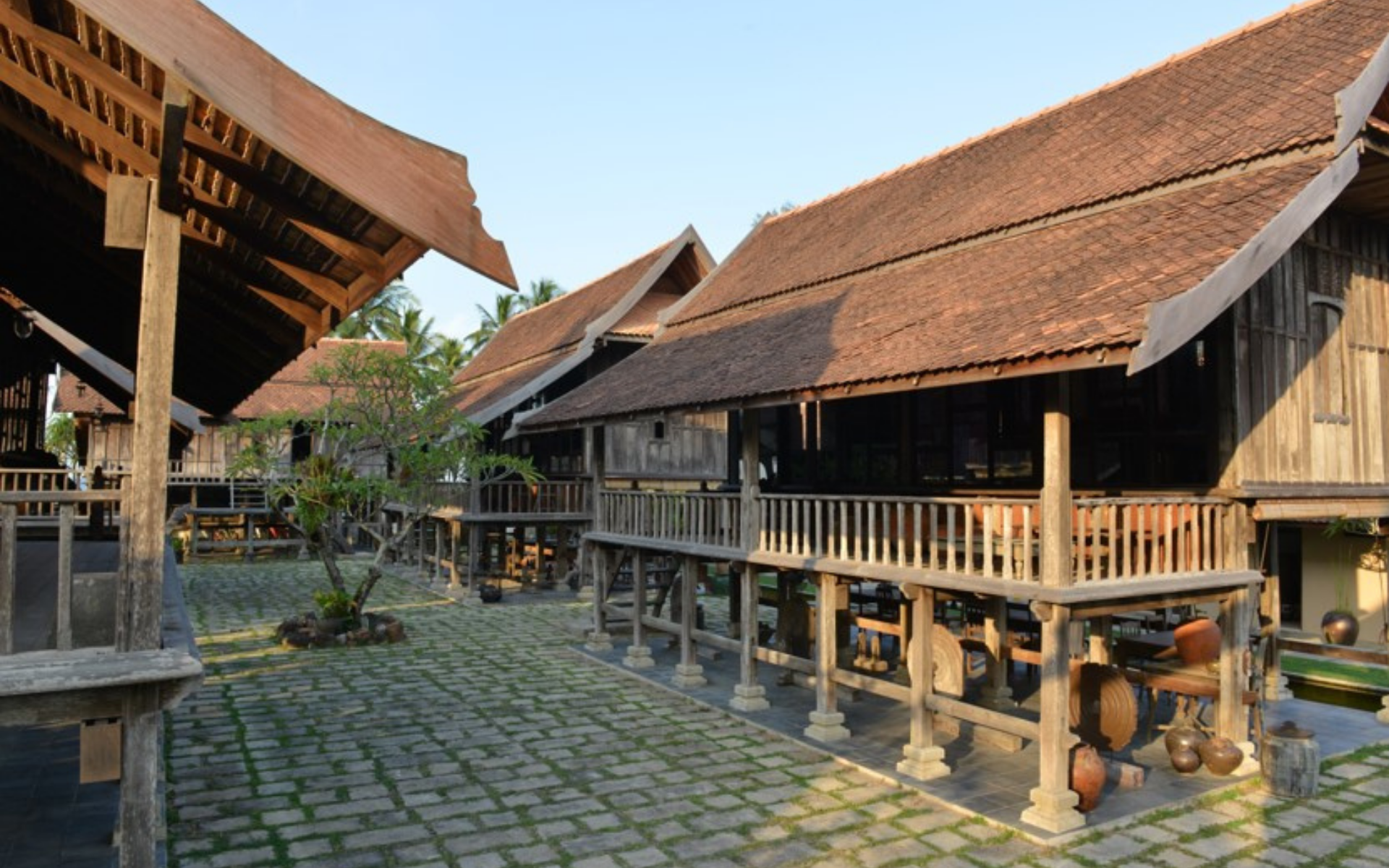 The internal courtyard features adapted traditional houses