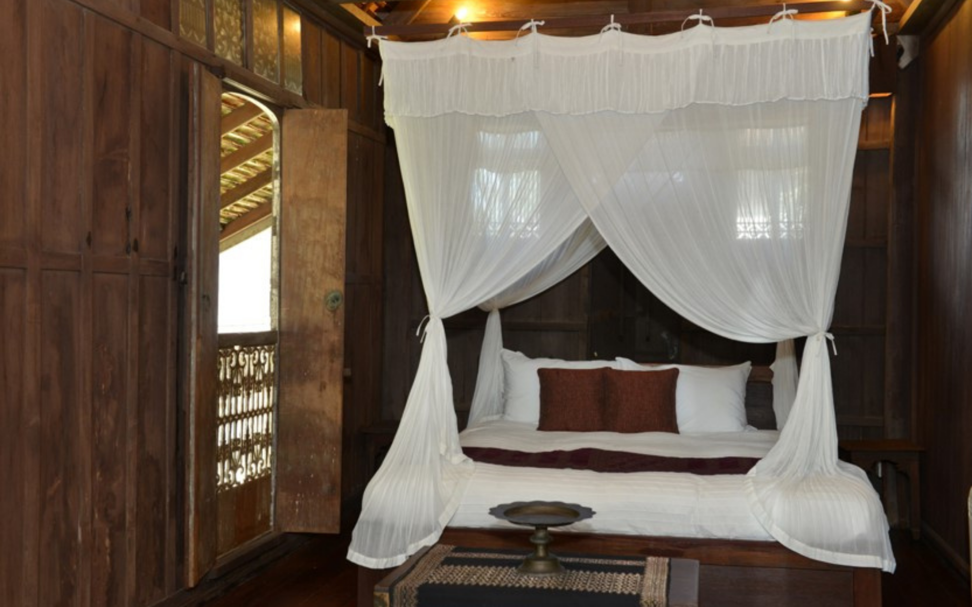 Romantic four poster beds complete with mosquito netting in the Terrapuri villas