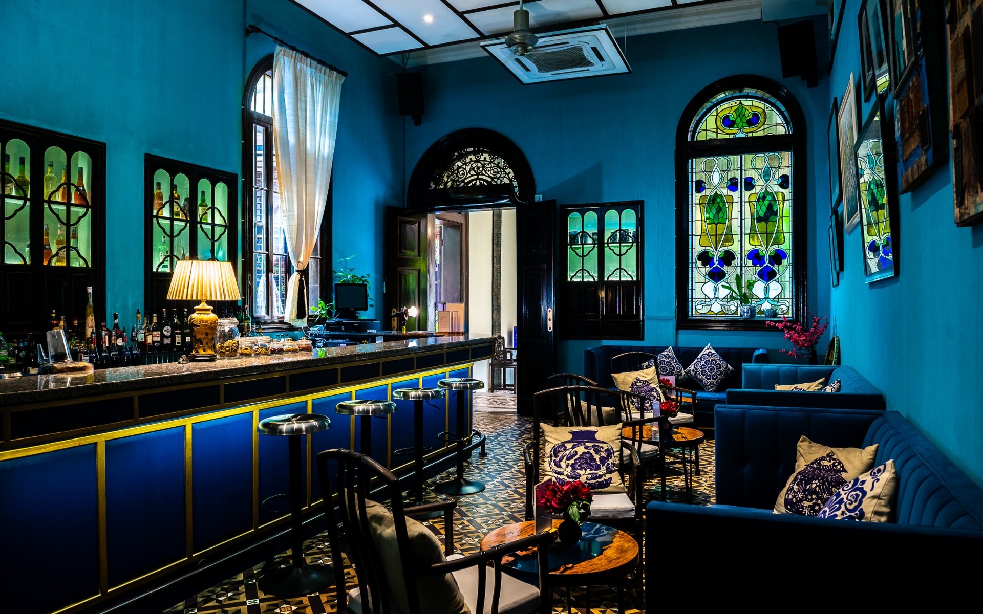 The Bar at the Blue Mansion features beautiful stained glass windows