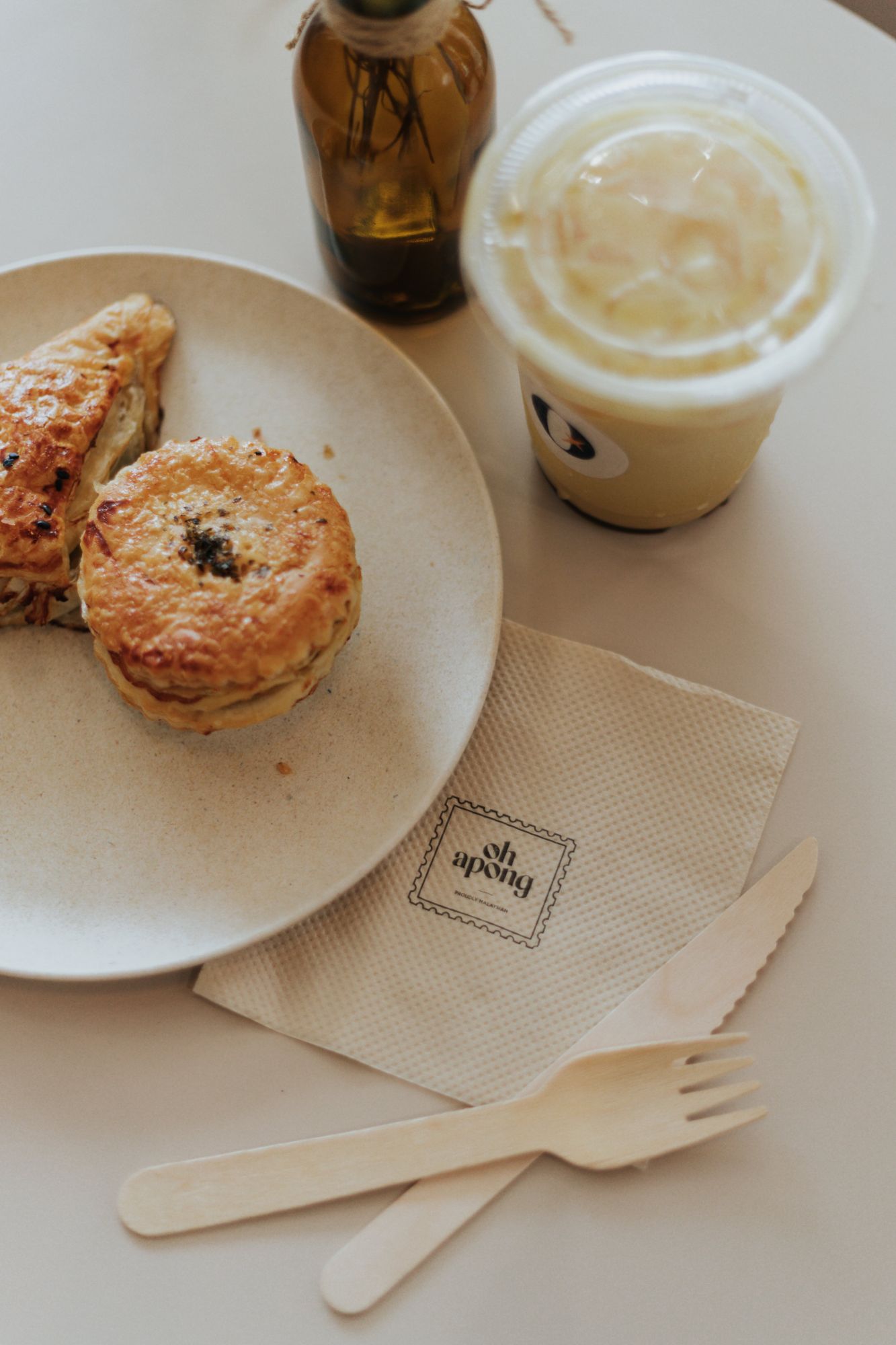 Some of Oh Apong's dishes, from left to right: the spicy tuna puff, mini chicken pot pie and the Iced Apong coffee latte
