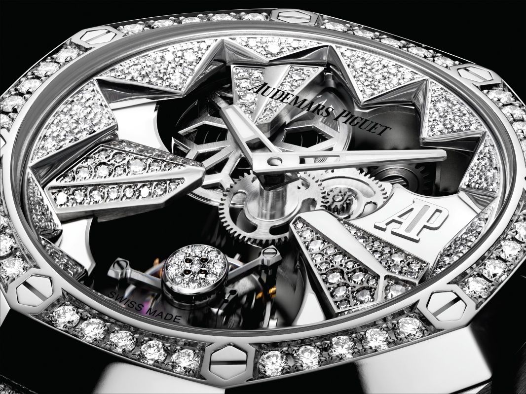 Satin-finished bridges, polished angles and white lacquered decorations are visible through the sapphire crystal caseback, and on the dial, there’s a glimpse of the openworked barrel at 11 o’clock, a snow flake amid diamond-set icicles.