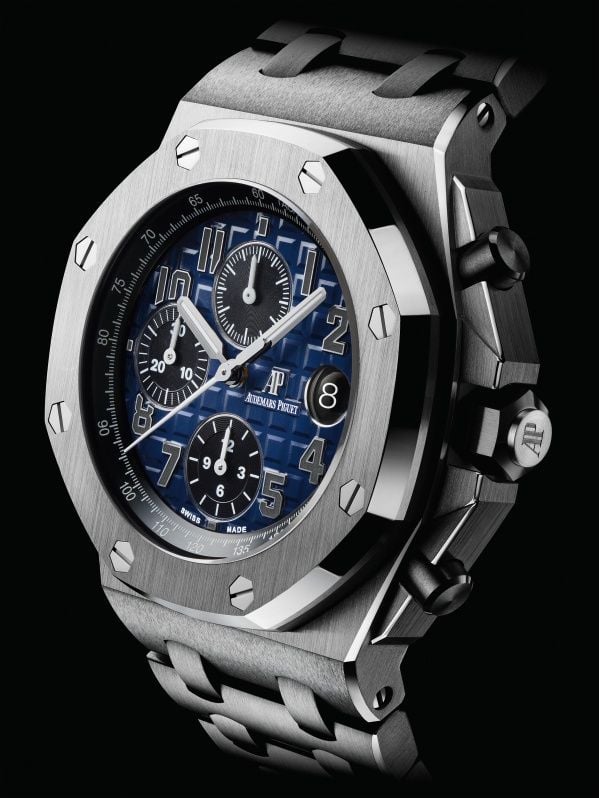 A moody version with platinum case, bracelet and smoked blue dial with black counters.