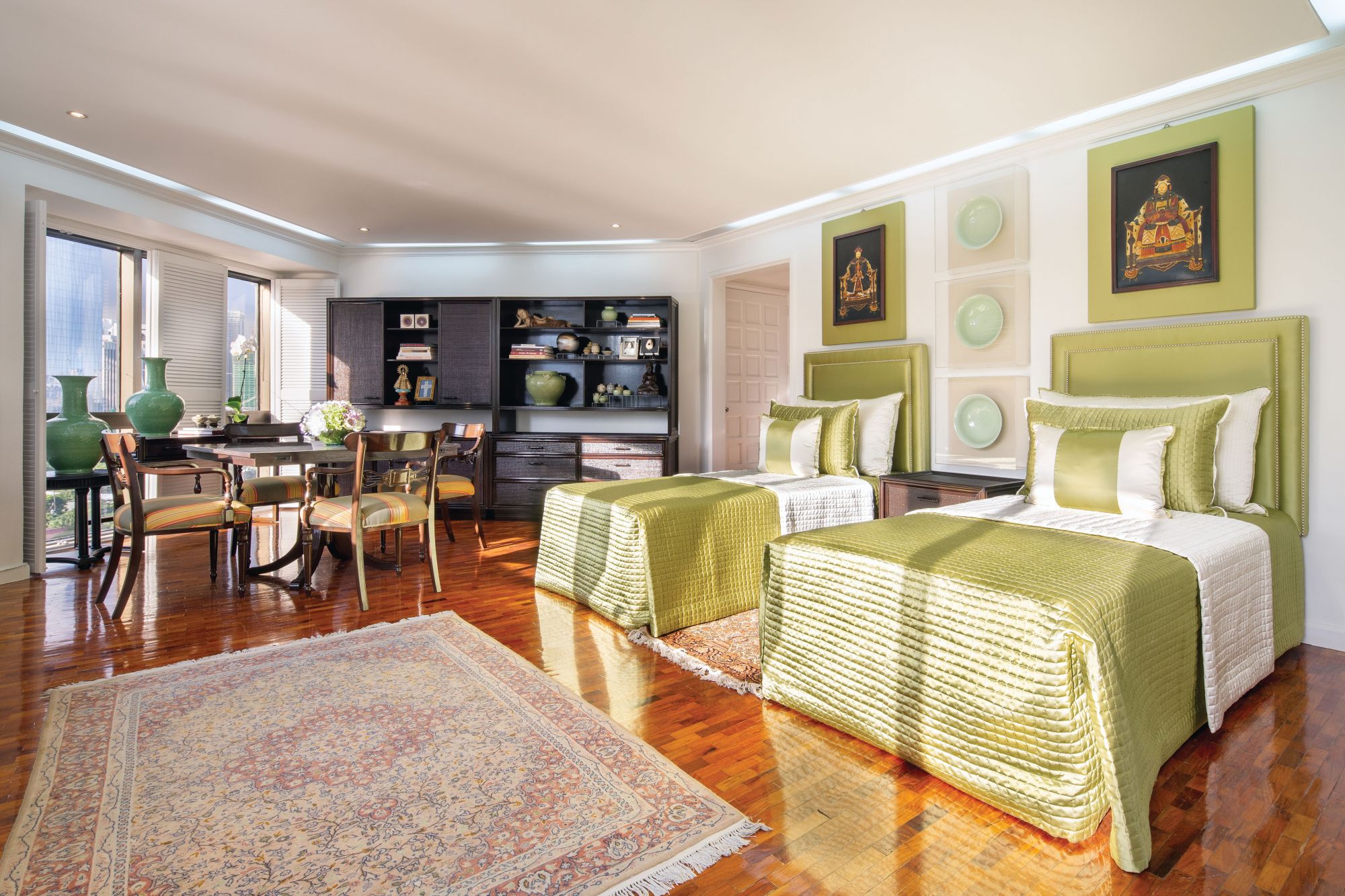 Oriental artefacts complement the green and white master’s suite