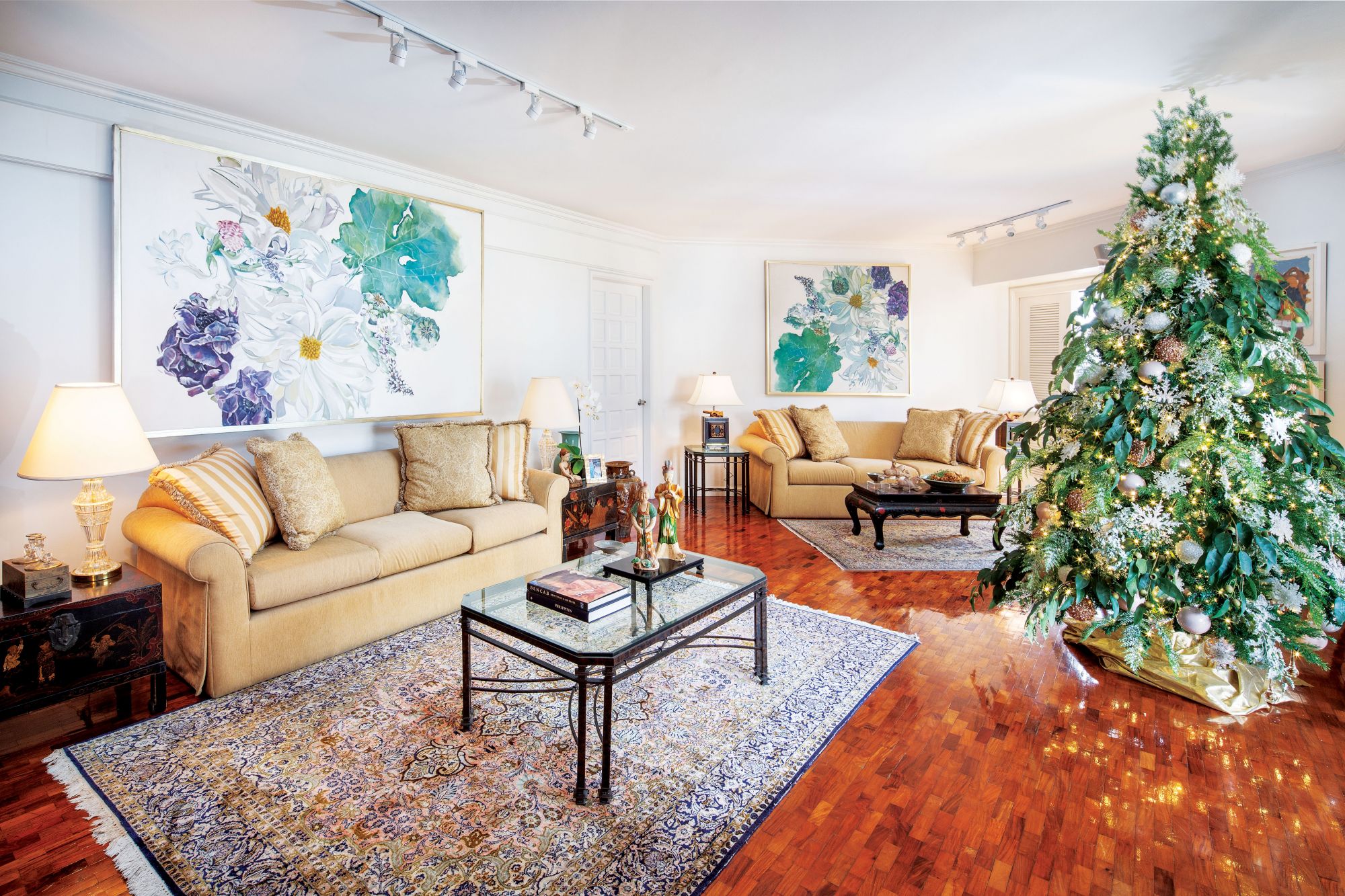 Glittering ornaments and fairy lights add holiday sparkle to the sitting room