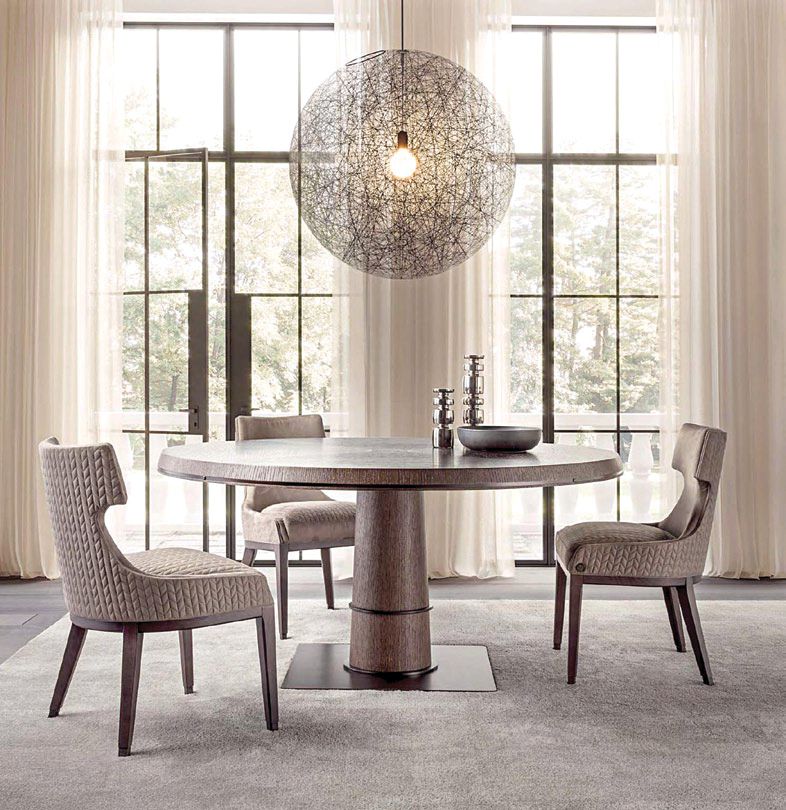 Oak and metal pair up beautifully in Medea Lifestyle's Tower round table, more so when matched with Kelly chairs in wood and fabric. Available at Furnitalia