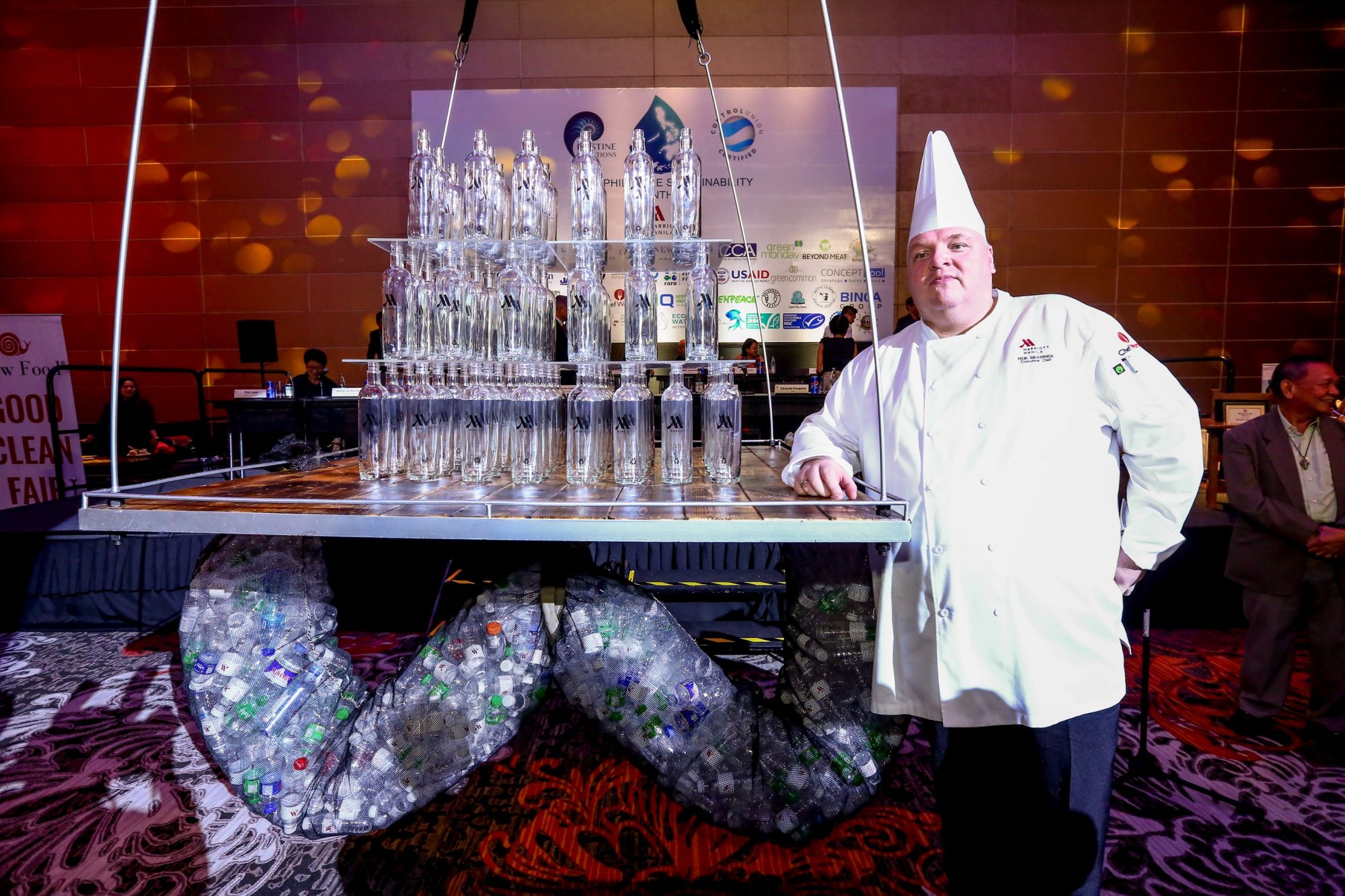 The refillable glass bottles dramatically descended from the ceiling of the ballroom as Executive Chef Meik Brammer announces the elimination of plastic bottles in Manila Marriott’s hotel rooms.