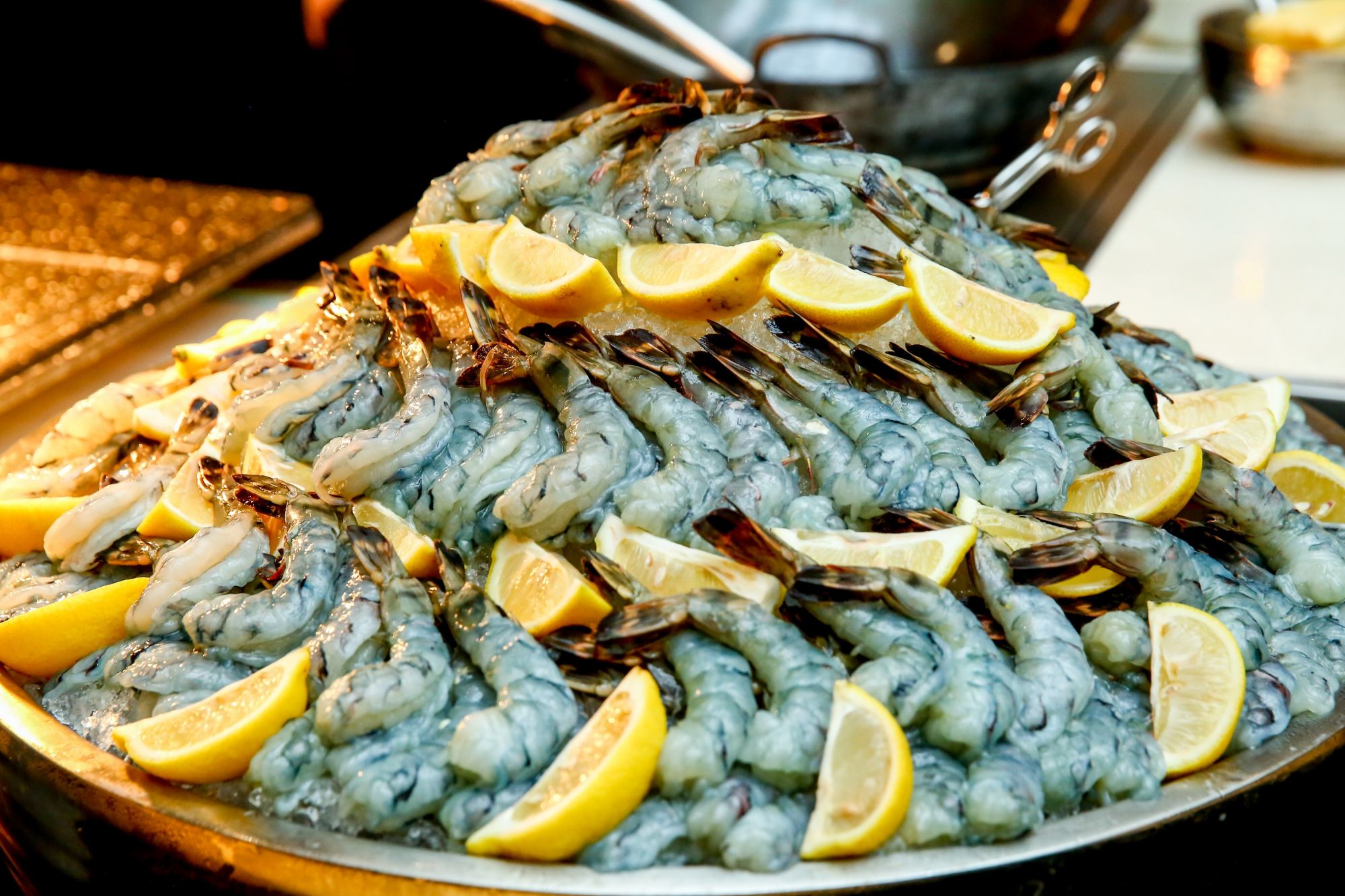 Various hors d'oeuvres such as oysters, shrimp, and tuna were served using sustainable seafood.