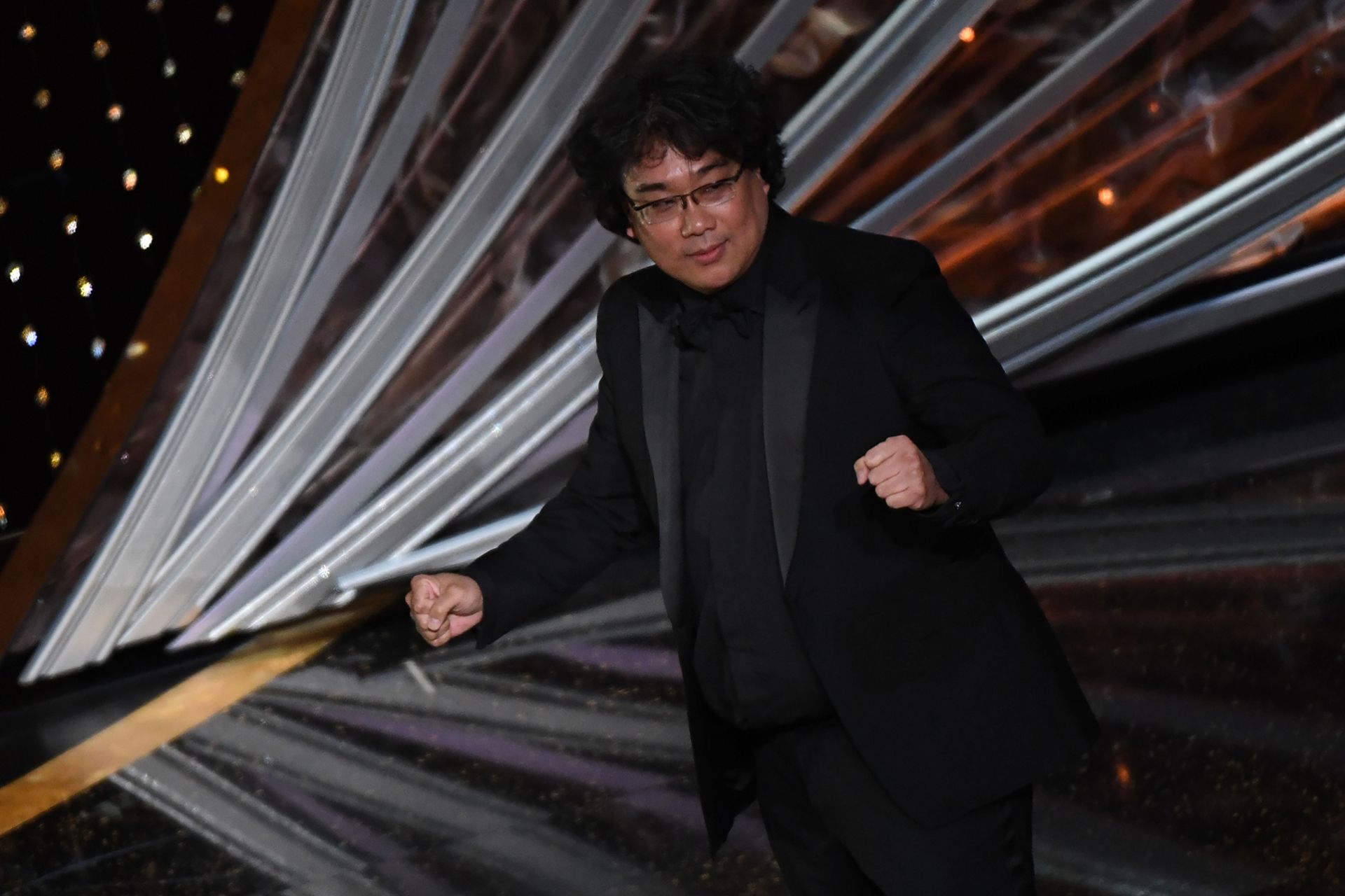 "Parasite" producer and director Bong Joon-ho celebrates after winning the award for Best Picture for "Parasite" during the 92nd Oscars at the Dolby Theatre in Hollywood, California on February 9, 2020. (Photo by Mark RALSTON / AFP)