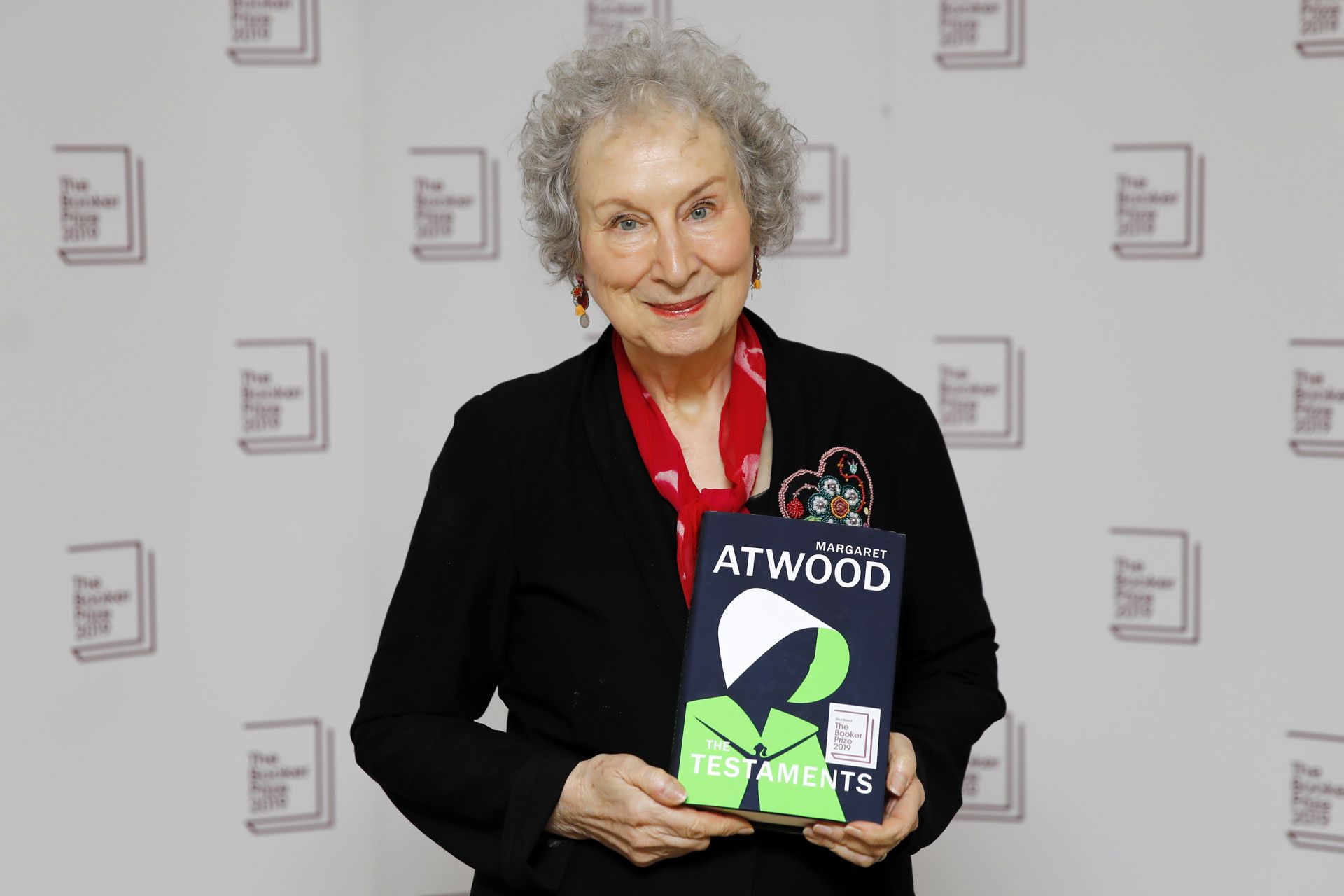Canadian author Margaret Atwood poses with her book 'The Testaments' during the photo call for the authors shortlisted for the 2019 Booker Prize for Fiction at Southbank Centre in London on October 13, 2019. (Photo by Tolga AKMEN / AFP)