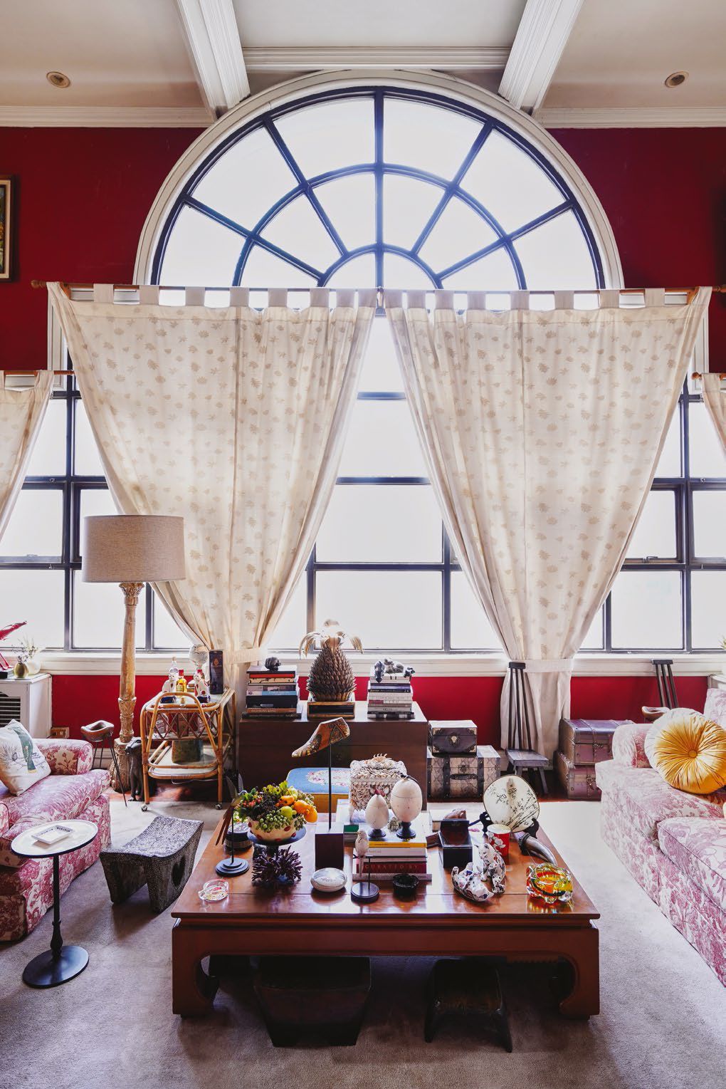 The unique, large arched windows are the dominant feature in their living space allowing beautiful natural light to flood in.