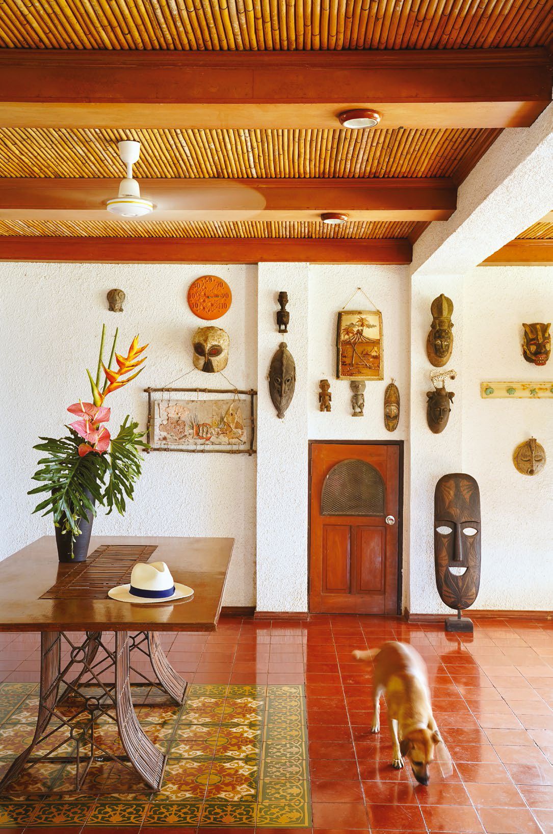 Their love for collecting is also apparent in their weekend home. The wall of masks are from their travels all over the world.