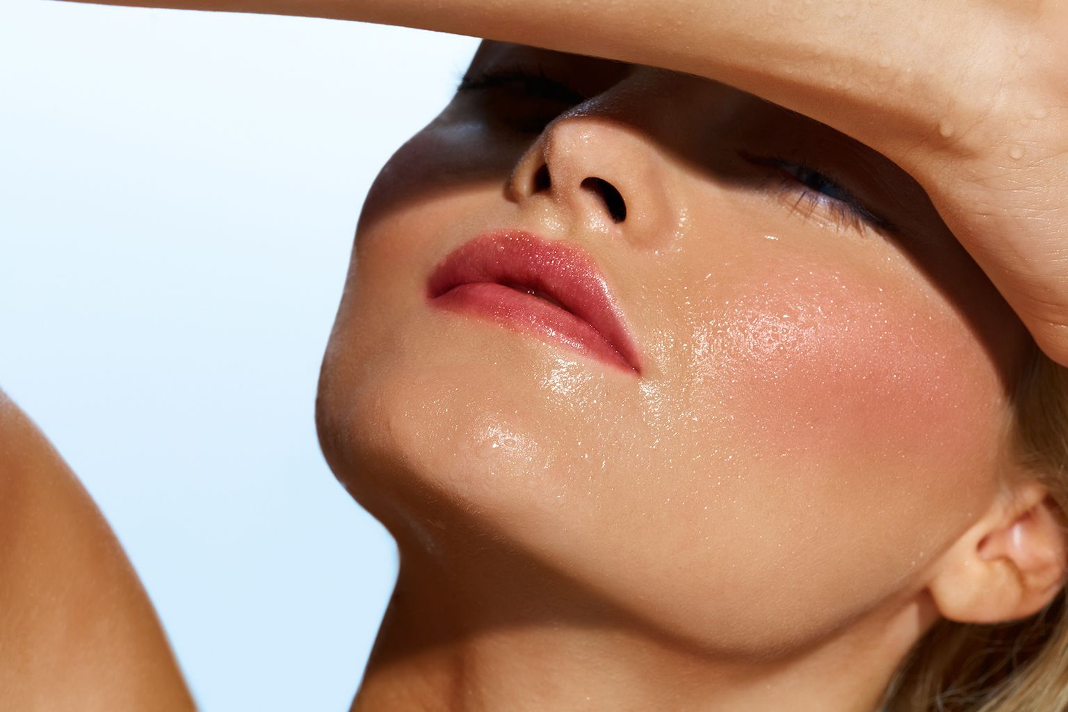 Woman with damp face covering from sun.
