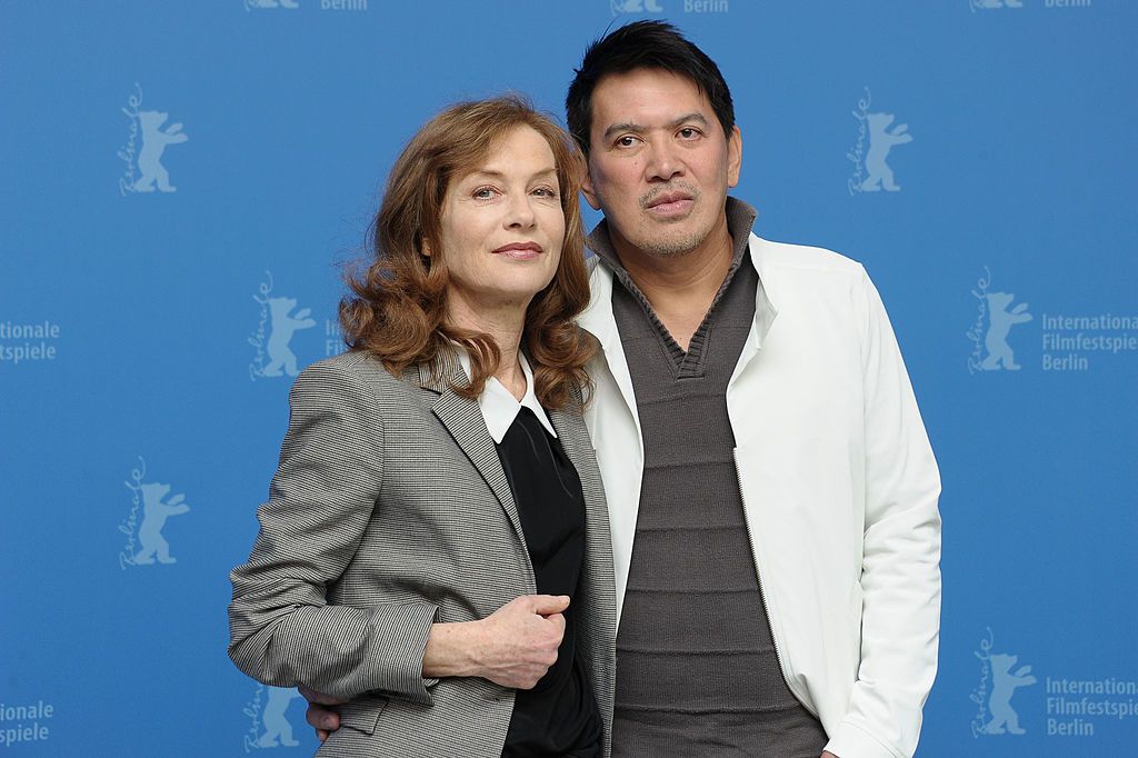 BERLIN, GERMANY - FEBRUARY 12: Actress Isabelle Huppert and director Brillante Mendoza attend the "Captive" Photocall during day four of the 62nd Berlin International Film Festival at the Grand Hyatt on February 12, 2012 in Berlin, Germany. (Photo by Dominique Charriau/WireImage)