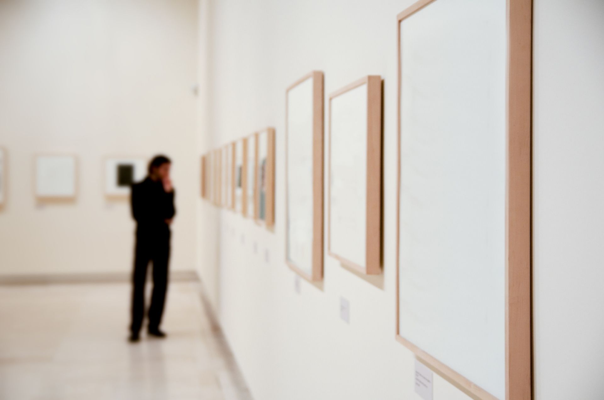 Art gallery with insignificant man out of focus