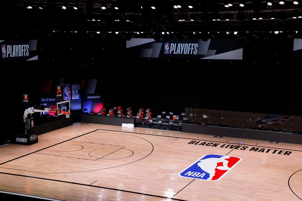 LAKE BUENA VISTA, FLORIDA - AUGUST 26: An empty court and bench is shown with no signage following the scheduled start time in Game Five of the Eastern Conference First Round between the Milwaukee Bucks and the Orlando Magic during the 2020 NBA Playoffs at AdventHealth Arena at ESPN Wide World Of Sports Complex on August 26, 2020 in Lake Buena Vista, Florida. The Milwaukee Buck have boycotted game 5 reportedly to protest the shooting of Jacob Blake in Kenosha, Wisconsin. NOTE TO USER: User expressly acknowl