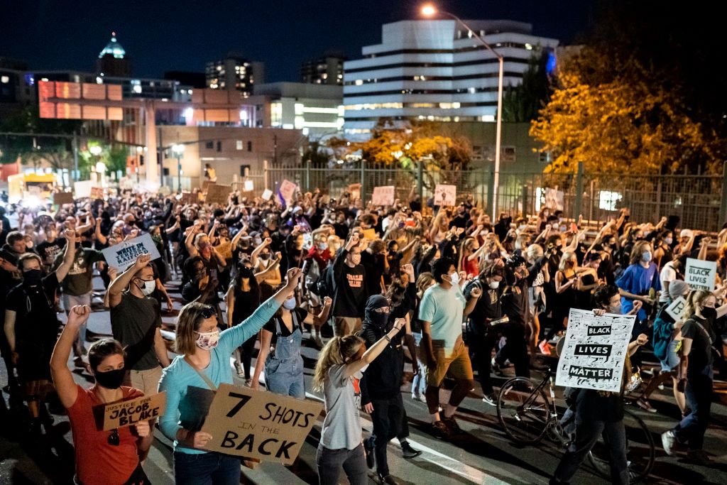 PORTLAND, OR - AUGUST 27: Peaceful protesters march through downtown in solidarity with Jacob Blake on August 27, 2020 in Portland, Oregon. Protests continued across the country Thursday night following the police shooting of Blake in Wisconsin. (Photo by Nathan Howard/Getty Images)