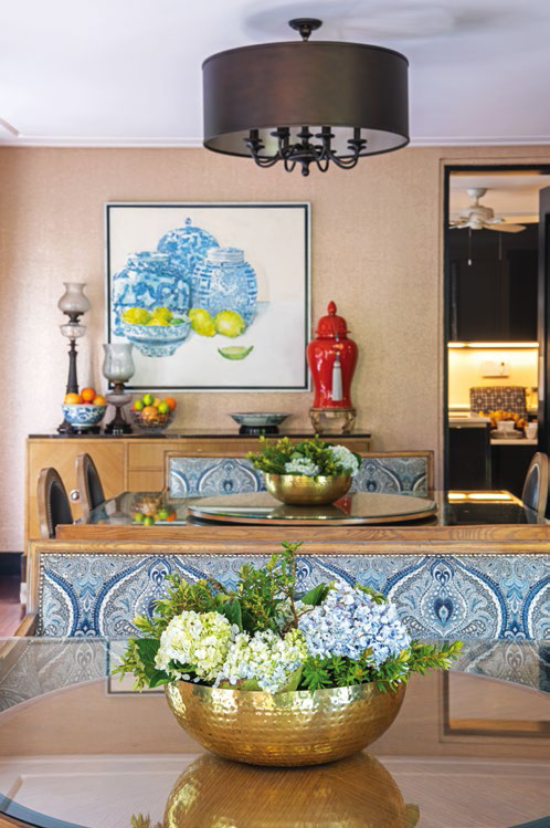 Designed to accommodate their whole family, the dining room features two square tables of eight