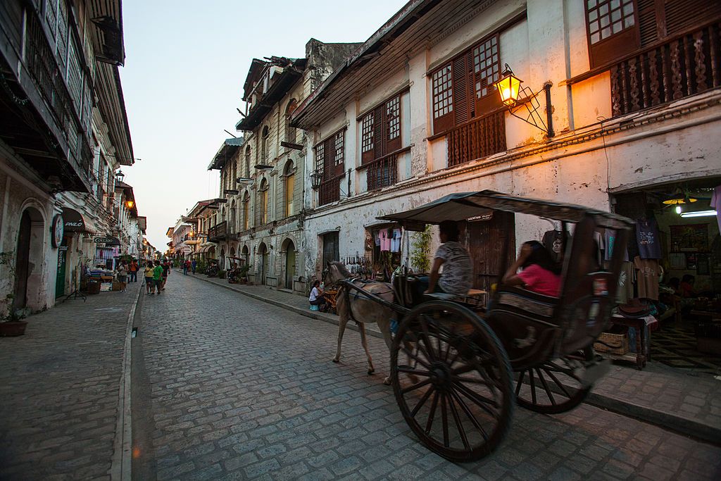 VIGAN, PHILIPPINES - 2010/02/13: Crisologo Street, Vigan Historical District -Vigan is the only town in the Philippines that has retained ts Spanish colonial architecture with a distinct identity of its own. Vigan's mestizo district was designated a UNESCO World Heritage site as the "Historic Town of Vigan." Calle Crisologo is one of the main attractions in the city of Vigan. It is a well preserved cobblestone street a few hundred meters in length and lined with many old restored buildings taking visitors b