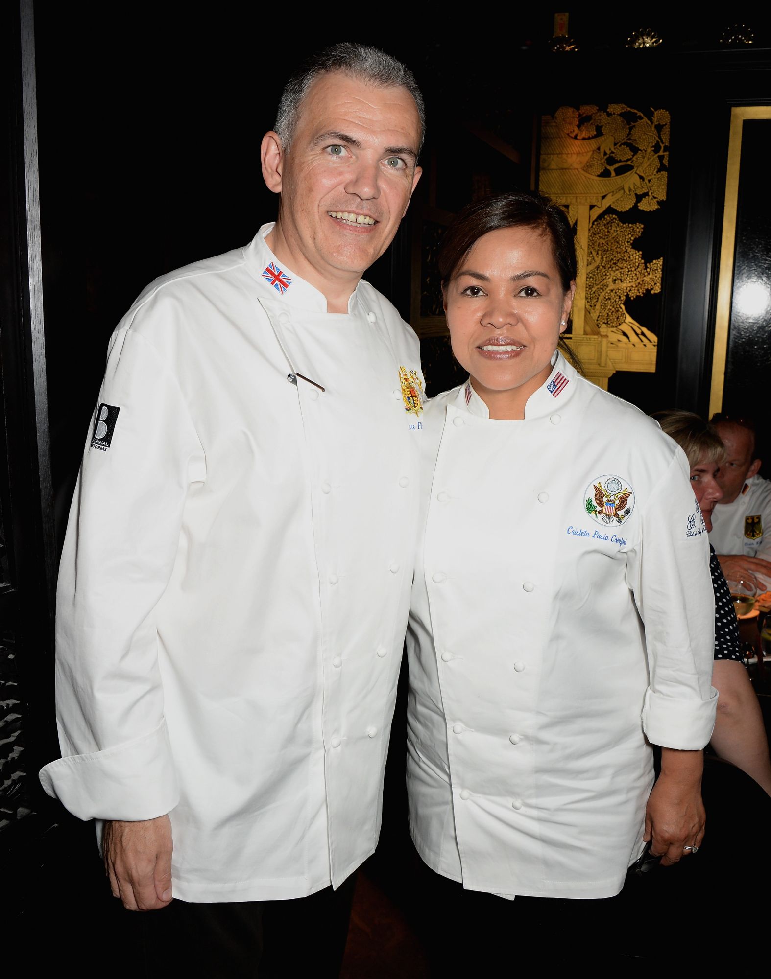 LONDON, ENGLAND - JULY 20: Head Chef to the UK Royal household Mark Flanagan and White House Executive Chef Cristeta Pasia Comerford attend Le Club des Chefs des Chefs dinner at Hakkasan Hanway Place on July 20, 2014 in London, England. (Photo by David M. Benett/Getty Images for Hakkasan Hanway Place)
