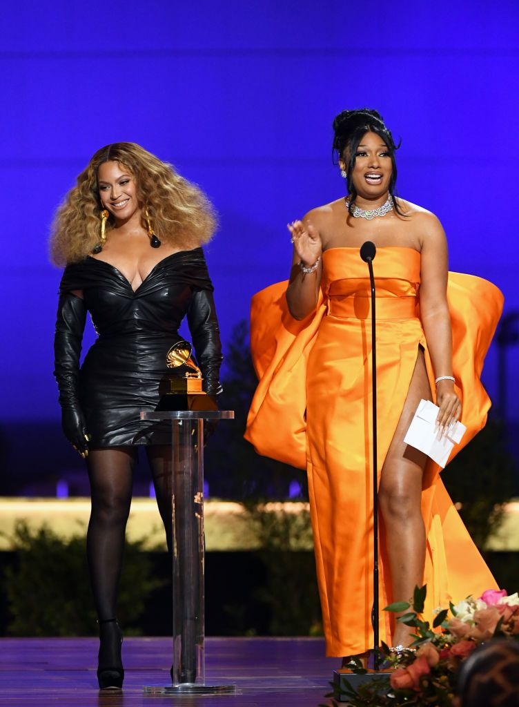 LOS ANGELES, CALIFORNIA - MARCH 14: (L-R) Beyoncé and Megan Thee Stallion accept the Best Rap Performance award for 'Savage' onstage during the 63rd Annual GRAMMY Awards at Los Angeles Convention Center on March 14, 2021 in Los Angeles, California. (Photo by Kevin Winter/Getty Images for The Recording Academy)