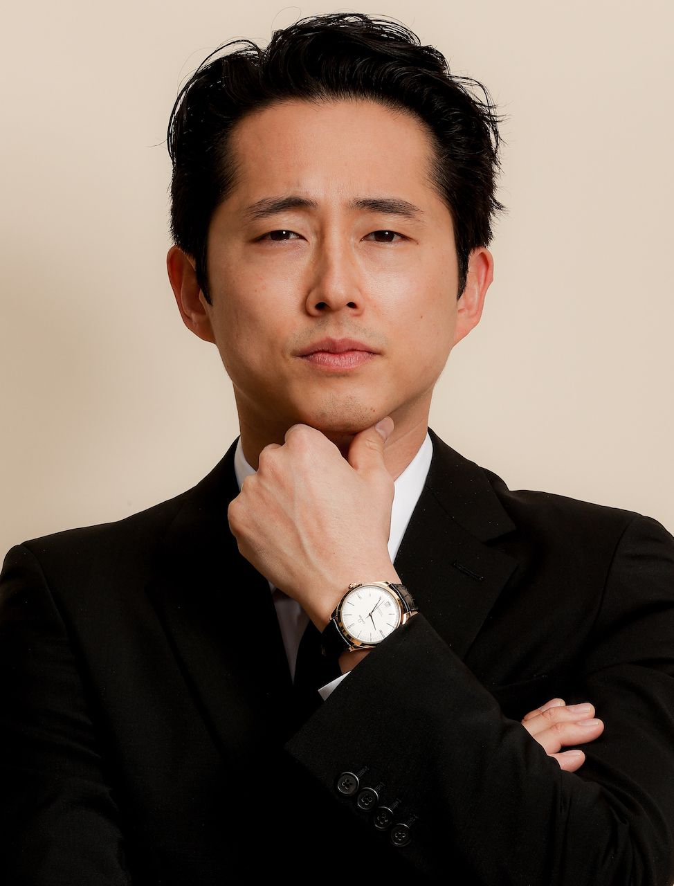 PASADENA, CALIFORNIA - MARCH 07: Steven Yeun, wearing PRADA, gets ready for the 26th annual Critics Choice Awards on March 07, 2021 in Pasadena, California. (Photo by Rich Fury/Getty Images for PRADA)