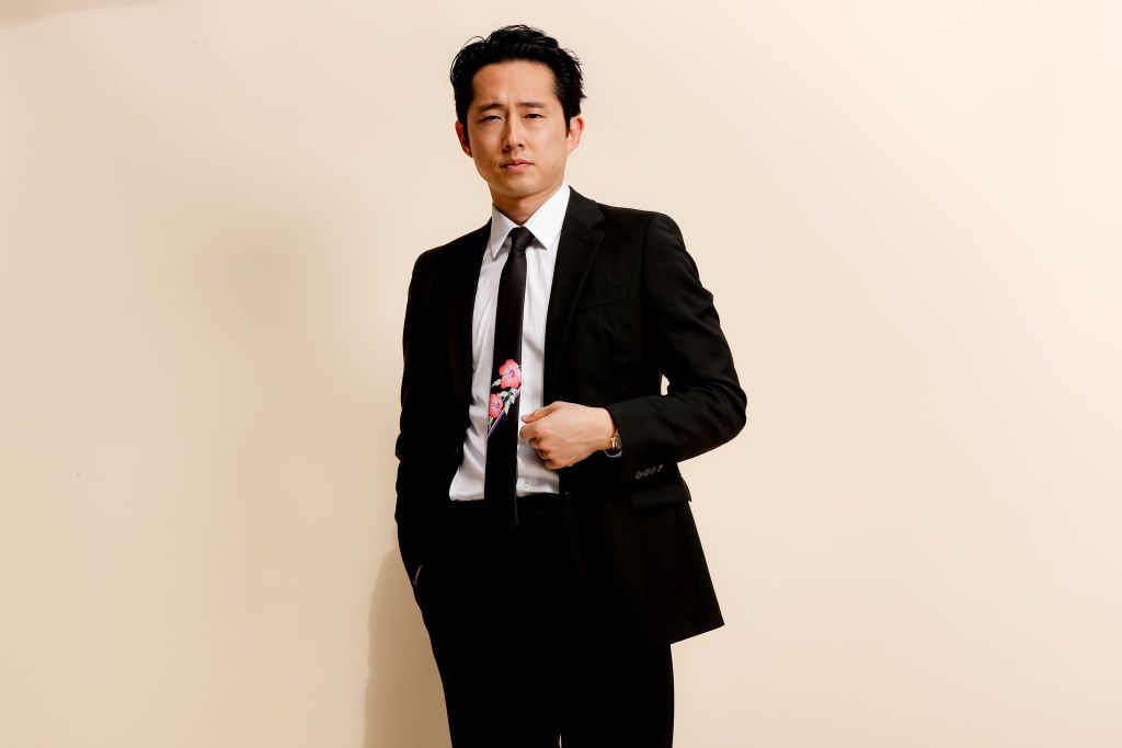 PASADENA, CALIFORNIA - MARCH 07: Steven Yeun, wearing PRADA, gets ready for the 26th annual Critics Choice Awards on March 07, 2021 in Pasadena, California. (Photo by Rich Fury/Getty Images for PRADA)