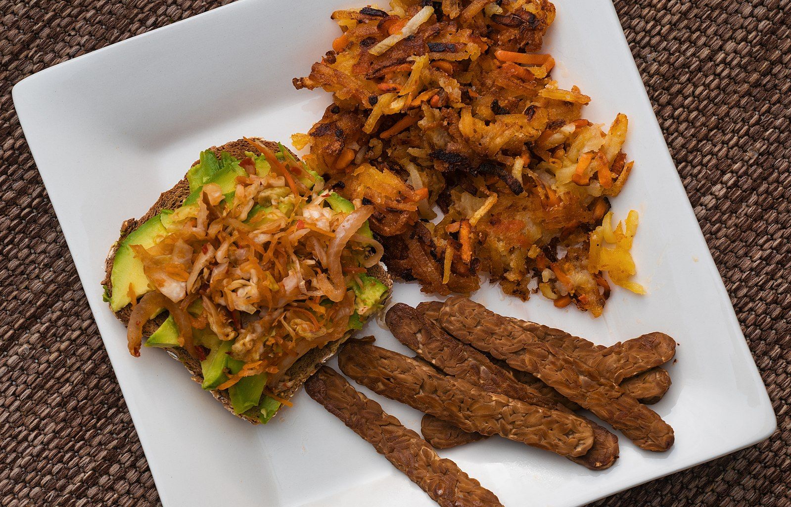 Avocado kimchi toast, tempeh bacon, and root vegetable hash browns. | Photo from Wikimedia Commons; Tony Webster