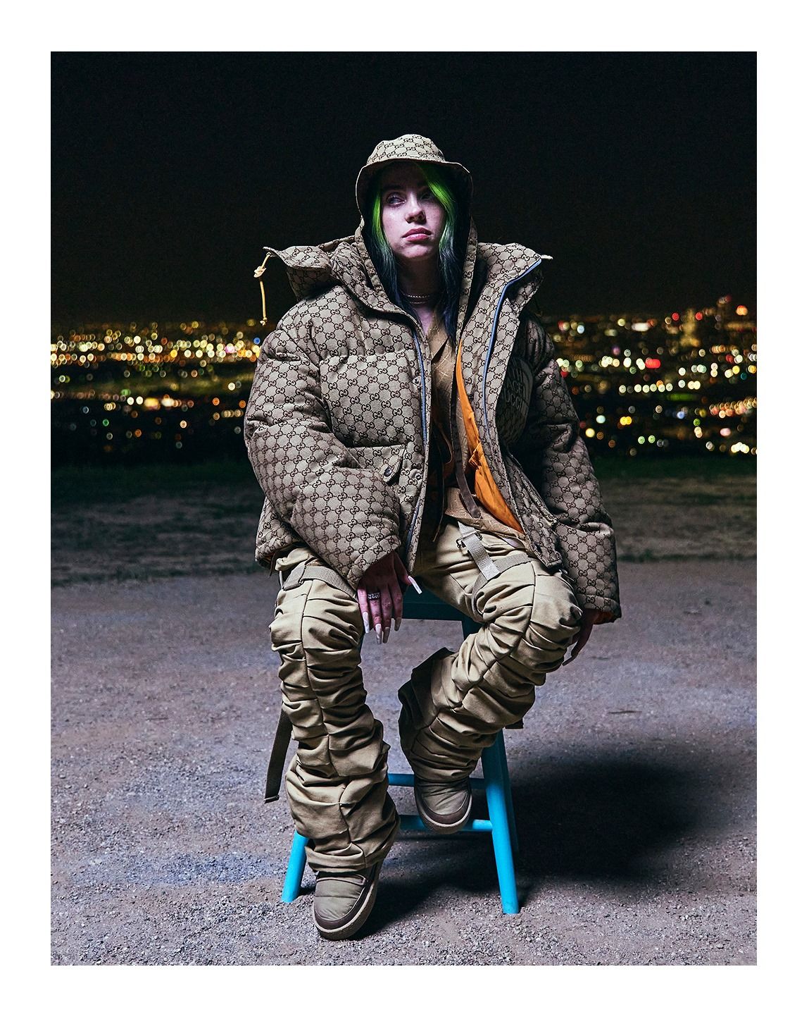 Billie Eilish wearing The North Face x Gucci puffer jacket and hat. | Photo: Gucci / Facebook
