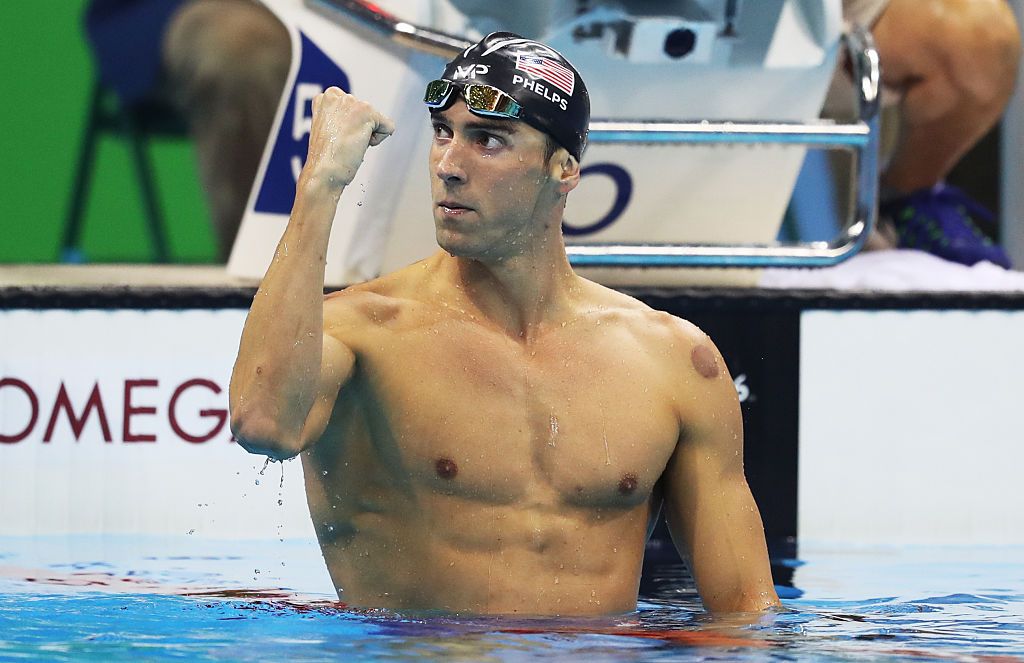 RIO DE JANEIRO, BRAZIL - AUGUST 08: Michael Phelps of United States celebrates winning the Men's 200m Butterfly and his 20th Olympic Gold medal on Day 4 of the Rio 2016 Olympic Games at the Olympic Aquatics Stadium on August 9, 2016 in Rio de Janeiro, Brazil. (Photo by Ian MacNicol/Getty Images)