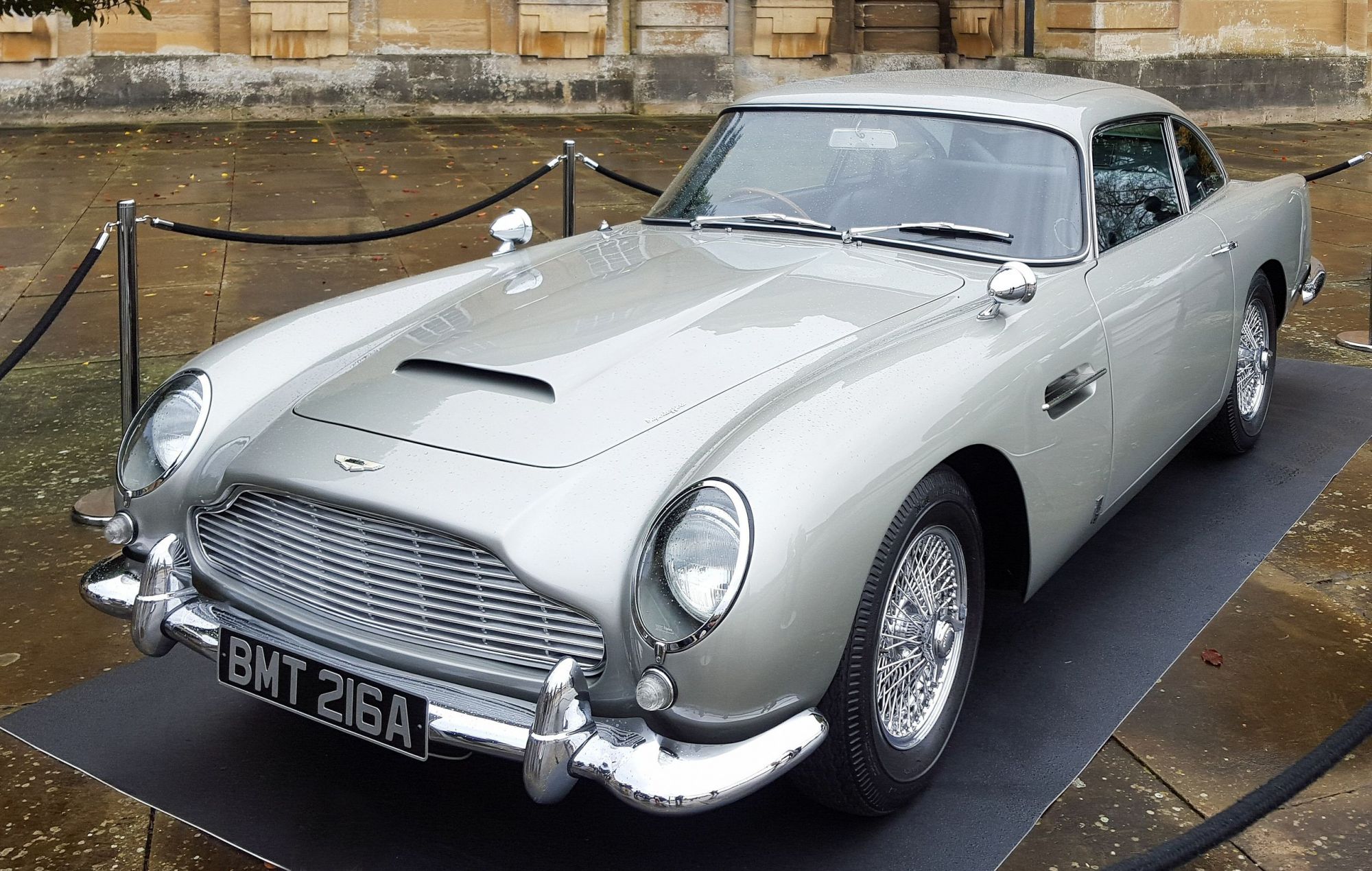 One of the Aston Martin DB5s used in the James Bond Skyfall film. Photographed in the Great Court at Blenheim Palace where it was on display for the premiere of the documentary DB10: Built for Bond. | Photo from Wikimedia Commons; DeFacto