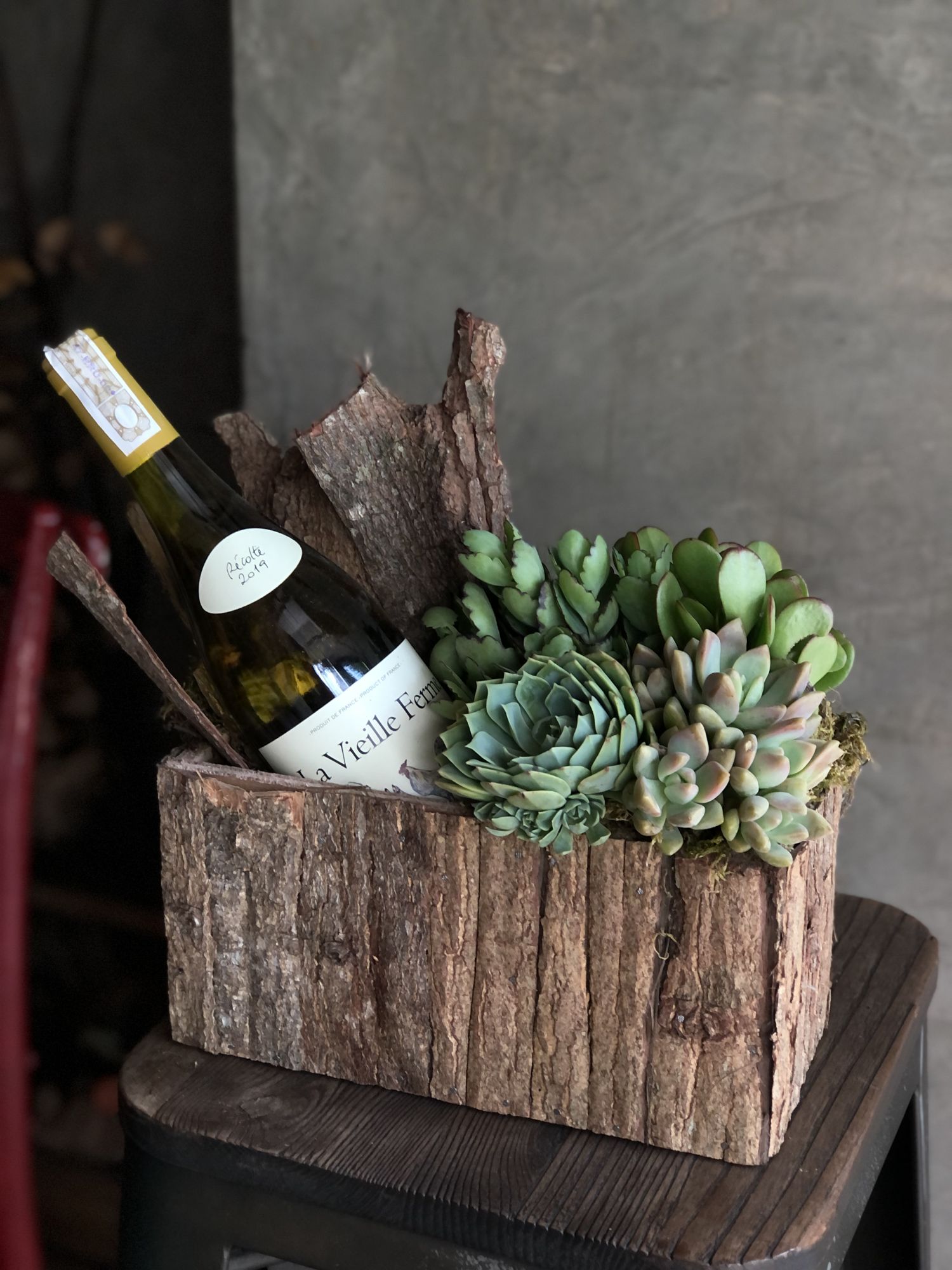 Fiori di Marghi's wine and succulent gift boxes come in a classic black or naturally beautiful bark wooden box.