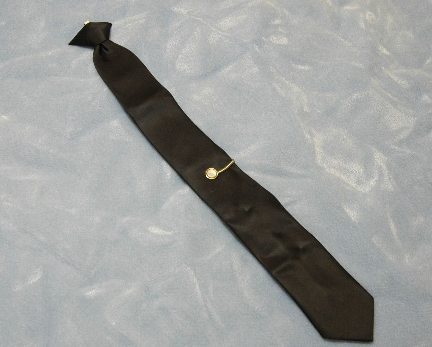 During the hijacking, Cooper was wearing this black J.C. Penney tie, which he removed before jumping; it later provided us with a DNA sample. | Photo: fbi.gov