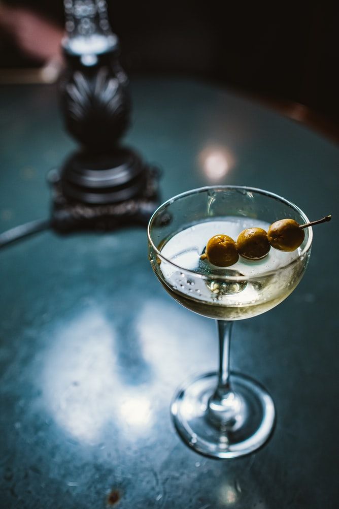 The classic gin martini garnished with olives for extra flavour - a great way to celebrate martini day!
