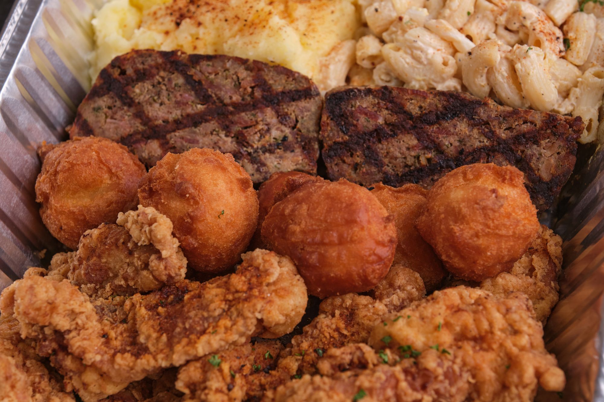 Take home Fireside's fried chicken fingers, 50/50 meatloaf, cornbread doughnuts, garlic mashed potatoes, and macaroni salad with tray 2.