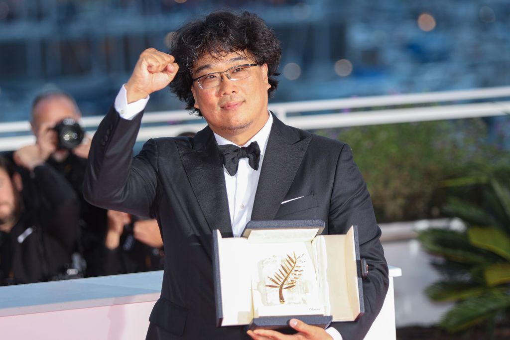 CANNES, FRANCE - MAY 25: Director Bong Joon-Ho, winner of the Palme d'Or award for his film "Parasite" poses at the winner photocall during the 72nd annual Cannes Film Festival on May 25, 2019 in Cannes, France. (Photo by Laurent KOFFEL/Gamma-Rapho via Getty Images)