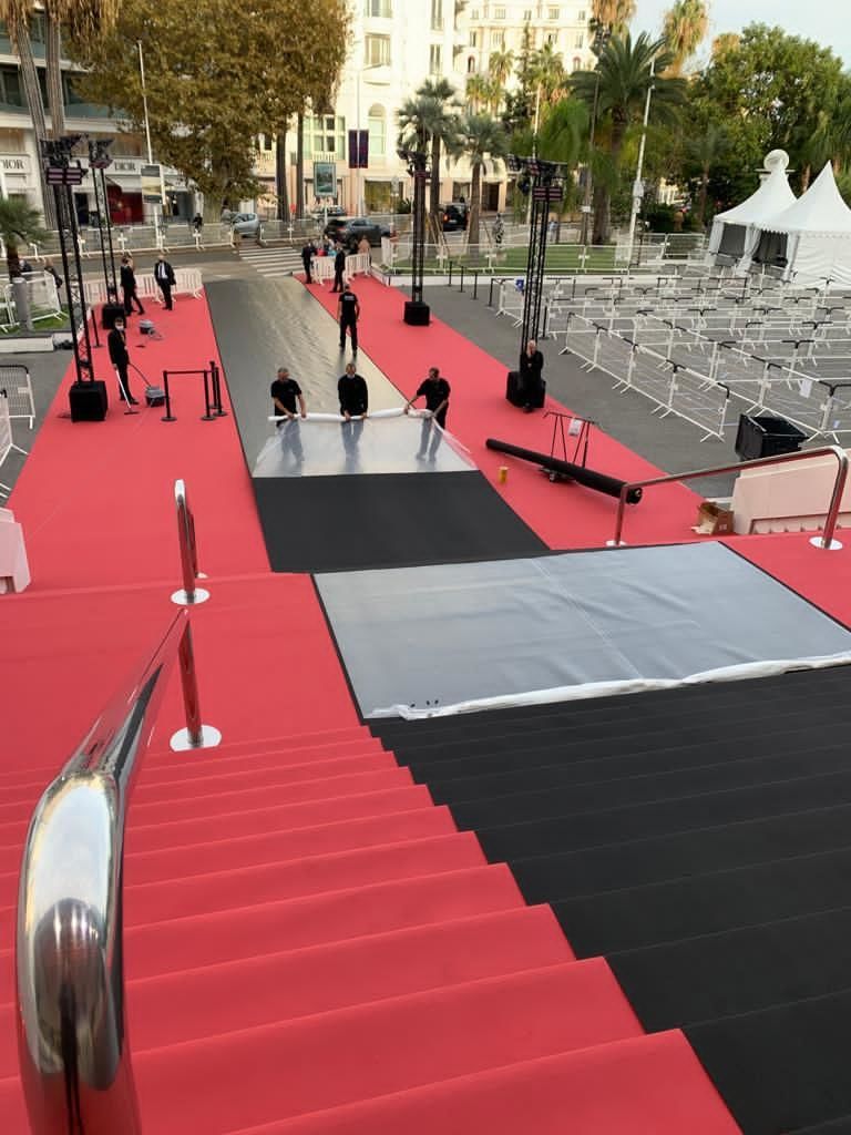 CANNES, FRANCE - OCTOBER 29: Workers install a black carpet at Palais des Festivals on October 29, 2020 in Cannes, France. Cannes Film Festival pays a tribute to Nice attack victims. A man armed with a knife fatally attacked people in the Notre-Dame church in Nice, located in the heart of the city on the morning of October 29th.
